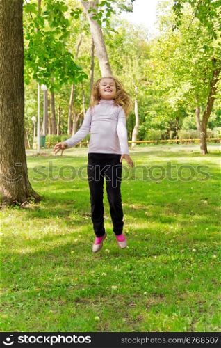 Photo of cute jumping girl in summer