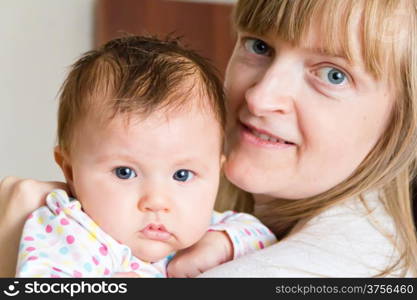 Photo of cute newborn infant girl and mother