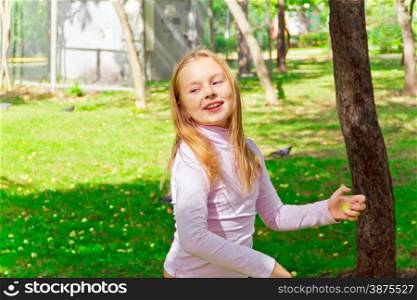 Photo of cute playing girl in summer