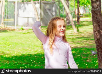 Photo of cute playing girl in summer