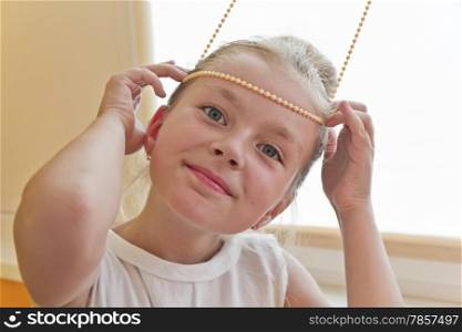 Photo of cute playing girl with blond hair
