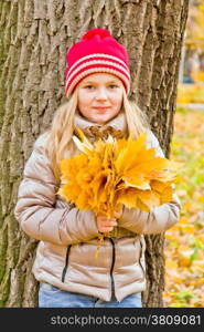 Photo of cute smiling girl in autumn