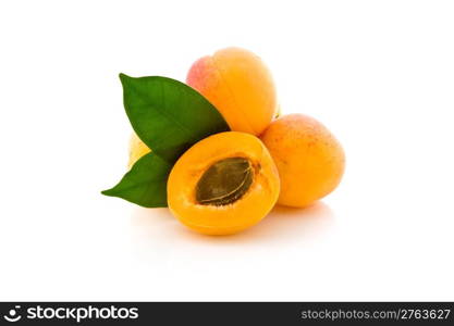 photo of delicious apricot with leaves on white background