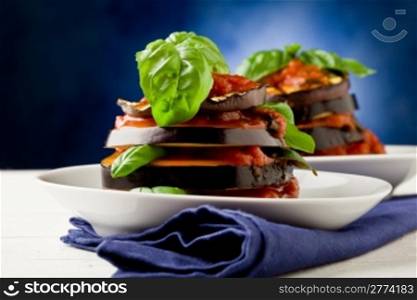 photo of delicious aubergine dish with tomato sauce called parmigiana