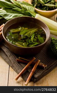 photo of delicious beet soup with vegetables on wooden table