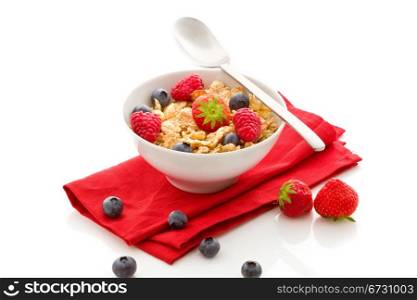 photo of delicious breafast isolated on white made of corn flakes with berries and fresh milk