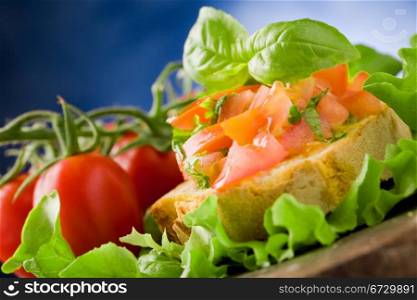 photo of delicious bruschetta appetizer with tomatoes and basil