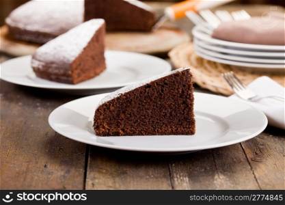 photo of delicious chocolate cake on wooden table