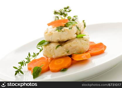 photo of delicious cod over carrots on isolated white background