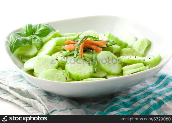 photo of delicious cucumber salad on green white napkin
