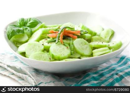 photo of delicious cucumber salad on green white napkin
