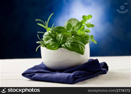 photo of delicious different herbs inside a bowl ready to be processed