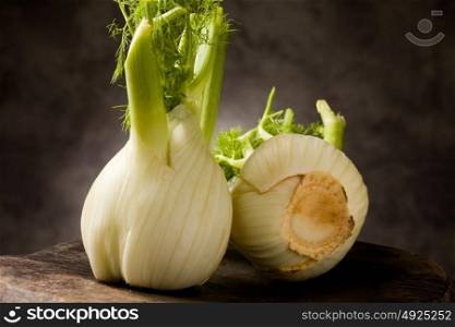 photo of delicious fresh fennel on wooden table
