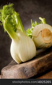 photo of delicious fresh fennel on wooden table