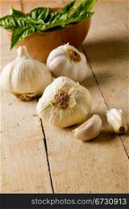 photo of delicious fresh garlic on wooden table - Selective Focus