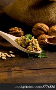 photo of delicious fresh ingredients for walnut pesto on wooden table