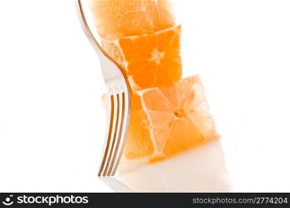 photo of delicious fresh stacked orange cubes on white background