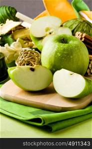 photo of delicious green apple on cutting board