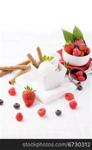 photo of delicious ice cream with berries on the table