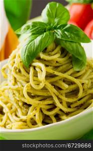 photo of delicious italian pasta with pesto sauce