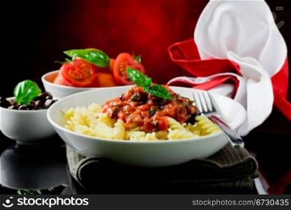 photo of delicious italian pasta with tomato sauce and basil
