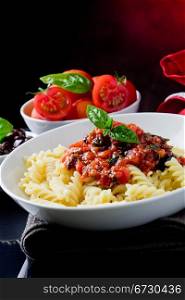 photo of delicious italian pasta with tomato sauce and basil