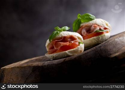 photo of delicious mozzarella stuffed with bacon slices and tomatoes