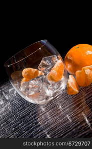 photo of delicious orange mandarins on ice cubes