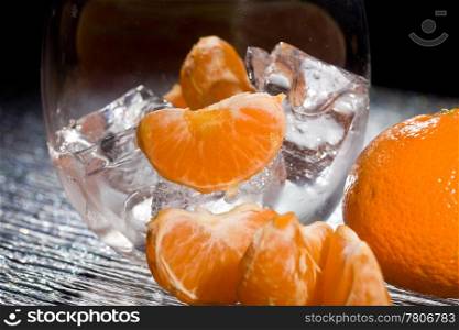 photo of delicious orange mandarins on ice cubes
