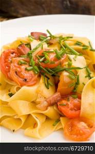 photo of delicious pasta with bacon and tomatoes