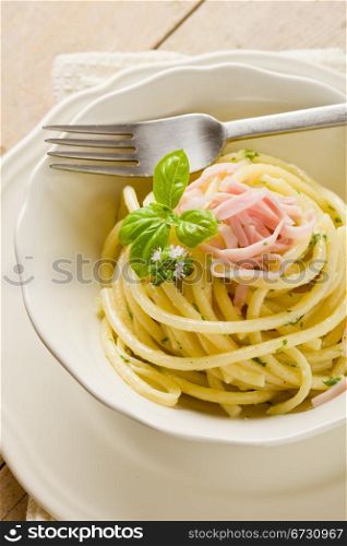 photo of delicious pasta with sour cream and ham