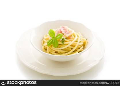 photo of delicious pasta with sour cream and ham on isolated background