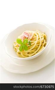photo of delicious pasta with sour cream and ham on isolated background