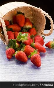 photo of delicious red strawberries inside a basket
