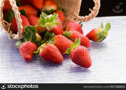 photo of delicious red strawberries inside a basket
