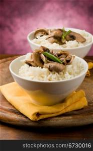 photo of delicious risotto with mushrooms on wooden table