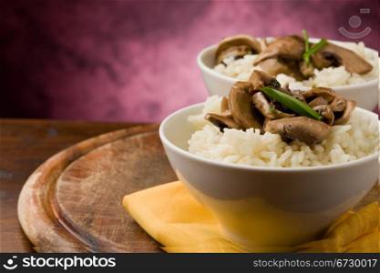 photo of delicious risotto with mushrooms on wooden table