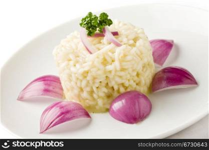 photo of delicious risotto with red onions on white isolated background