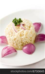 photo of delicious risotto with red onions on white isolated background