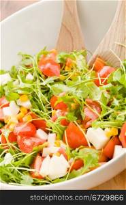 photo of delicious rocket salad with tomatoes and mais