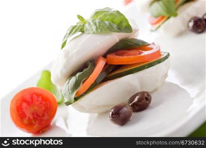 photo of delicious stuffed mozzarella sandwich with oil and basil