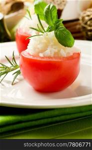 photo of delicious stuffed tomatoes with rice and basil