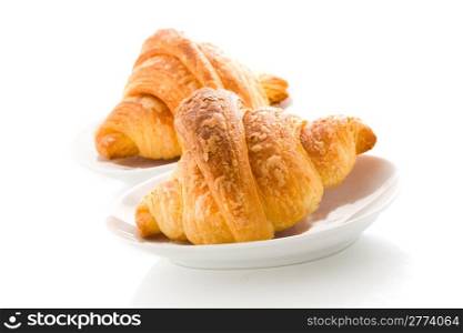 photo of delicious tasty golden croissants on white background