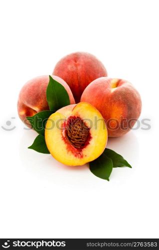 photo of delicious tasty peaches on white background with leaves