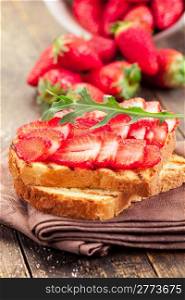 photo of delicious tasty strawberry arugula sandwich