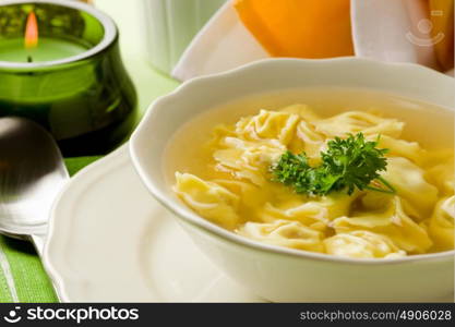 photo of delicious tortellini in bouillon