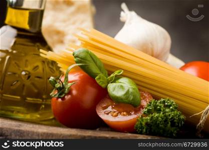 photo of different ingredients for preparing pasta with tomato sauce