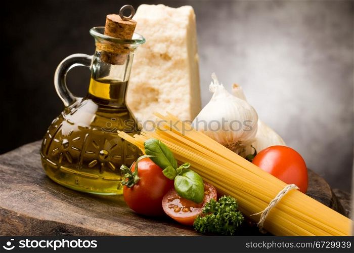 photo of different ingredients for preparing pasta with tomato sauce