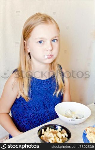 Photo of eating cute girl with blond hair