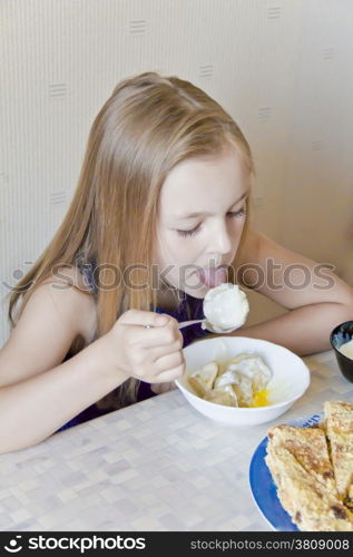 Photo of eating cute girl with blond hair